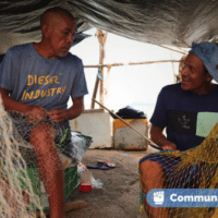 Mending the nets in a collective shelter. (Rome Arrieche)